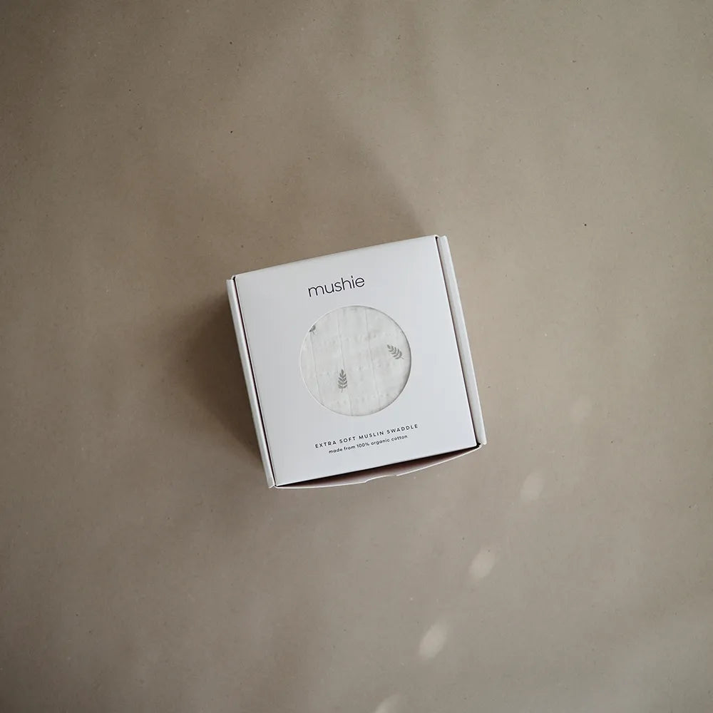 Mushie baby wrap